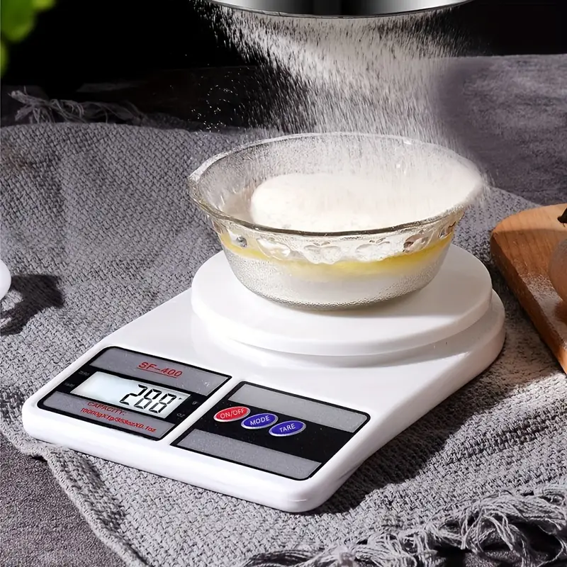 Person using digital kitchen scale to measure ingredients