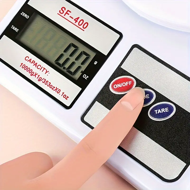 Close-up of mode button on digital kitchen scale