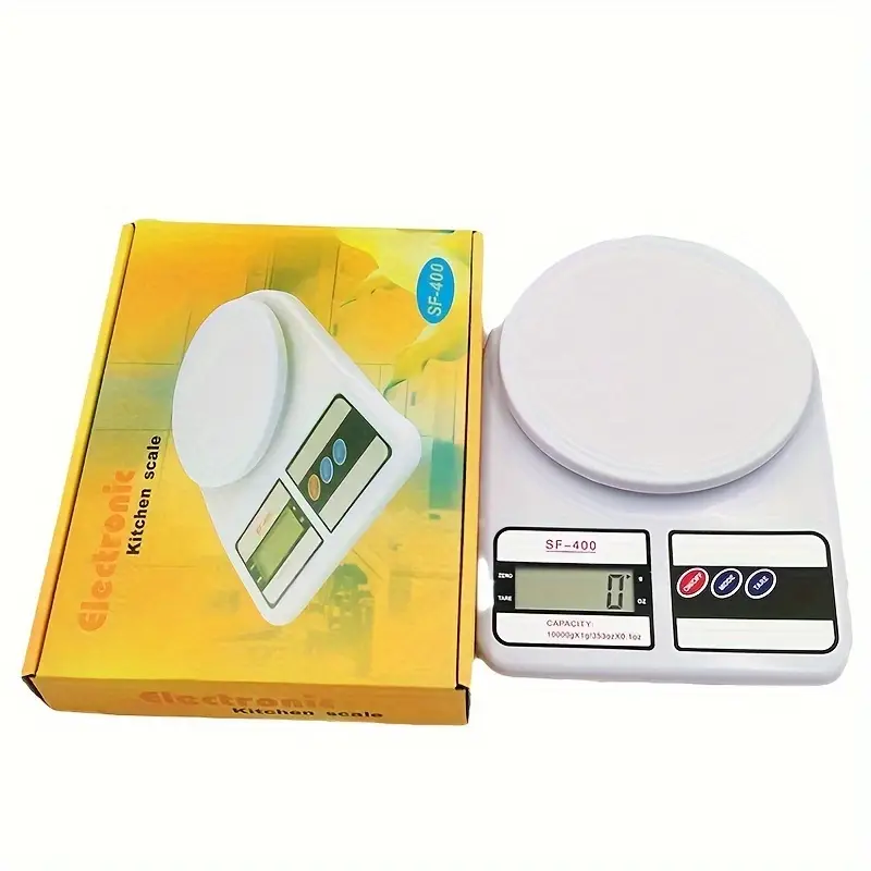 Digital kitchen scale shown in original packaging box