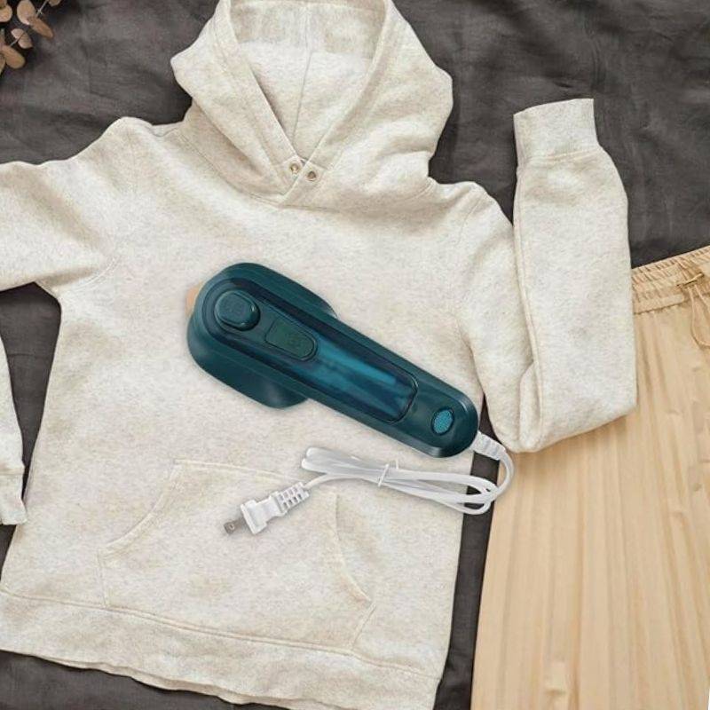 Using Portable Mini Steam Iron on clothes